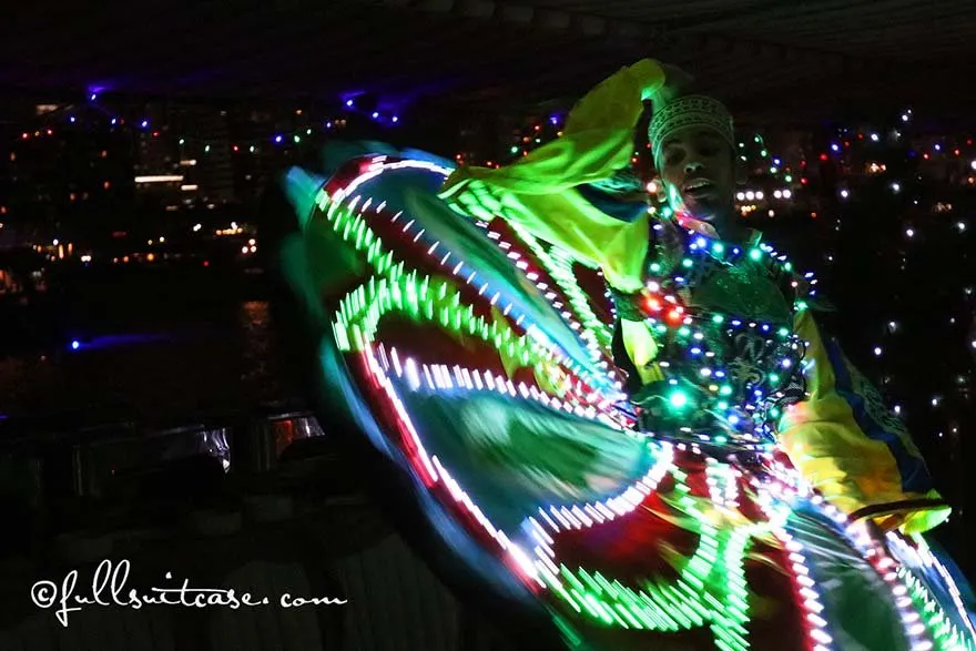 Tanoura dance performance with skirt lit in the dark in Dubai