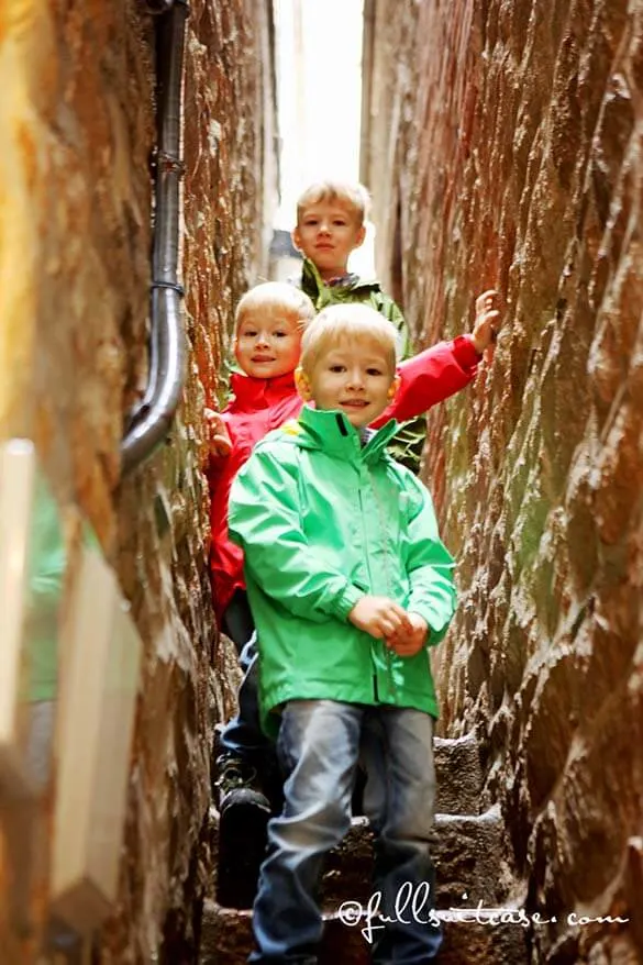 Kids exploring narrow streets at Mont Saint Michel