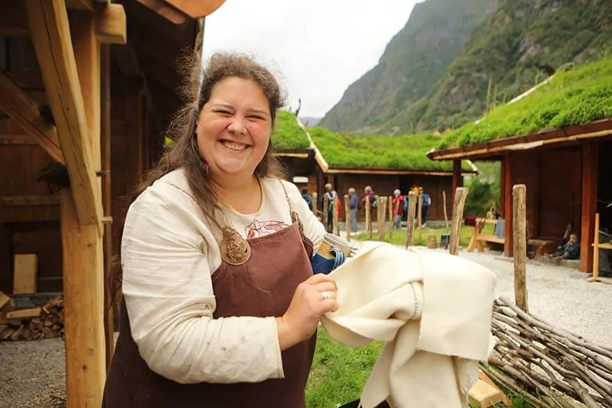 Viking lady demonstrating a waterproof wool cape in Gudvangen Flam Norway