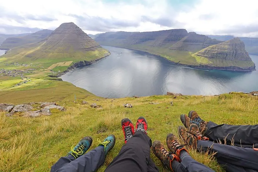 Family hiking in the northern Faroe Islands near Vidareidi village