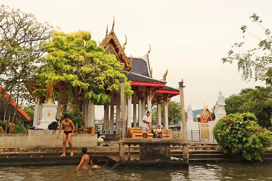 Local children swimming in a canal in Thonburi neighbourhood