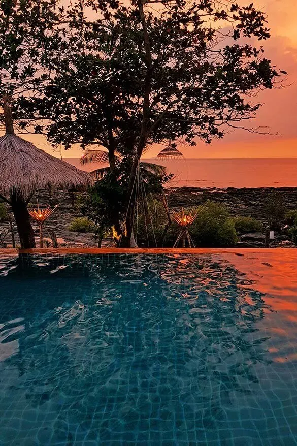 Red sunset at infinity pool of our Coco Cape Lanta Resort in Koh Lanta Thailand