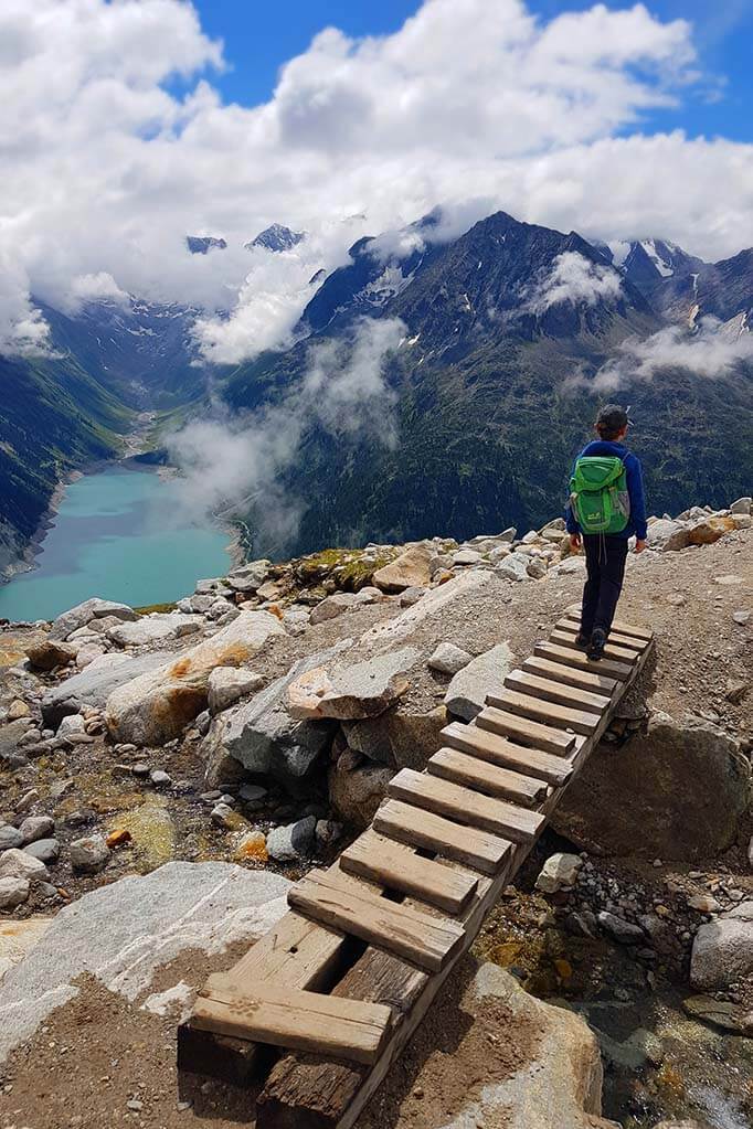 Kid hiking between Olperer bridge and Olperer mountain hut.