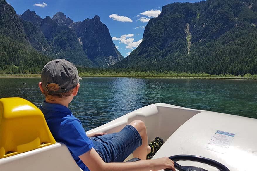 Riding a pedalo boat at Lago di Dobbiaco in the Italian Dolomites