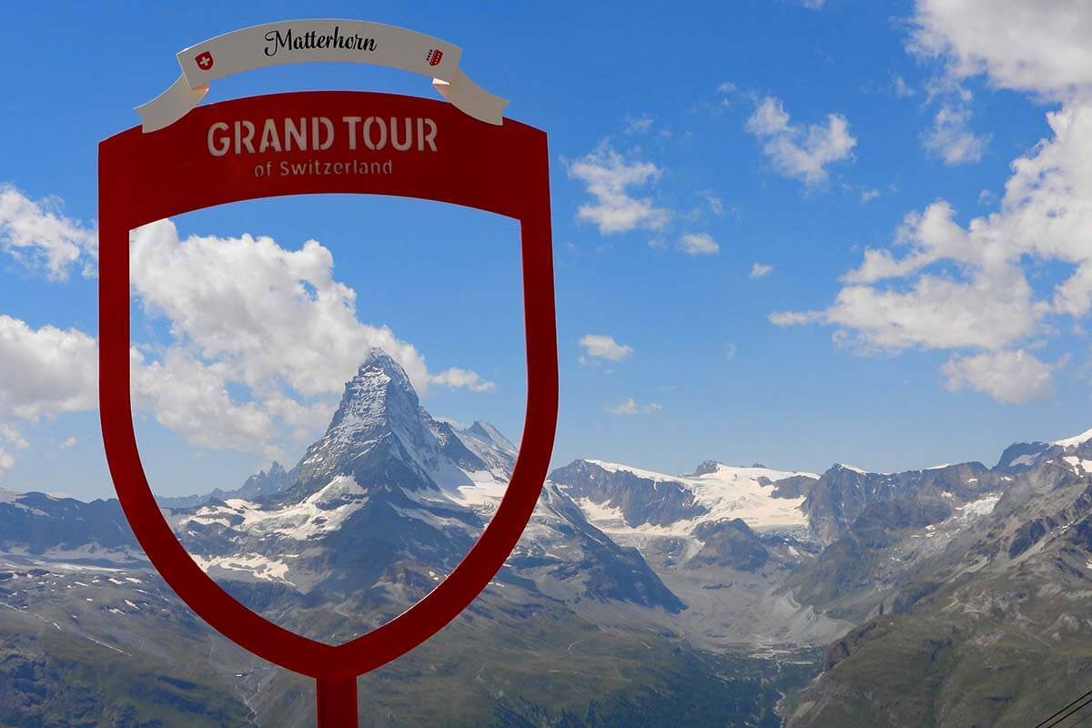 Grand Tour of Switzerland sign with Matterhorn view from Rothorn in Zermatt