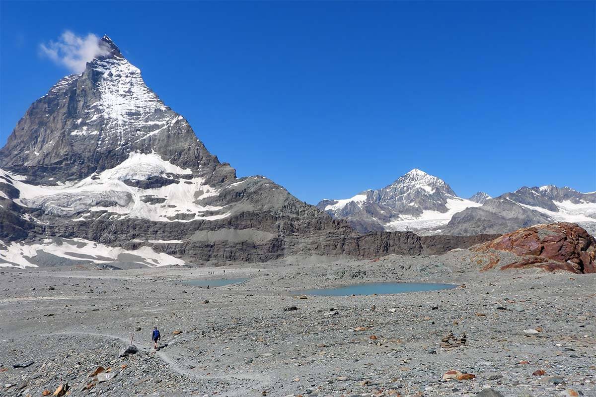 Hiker hiking at the Matterhorn in Zermatt Switzerland