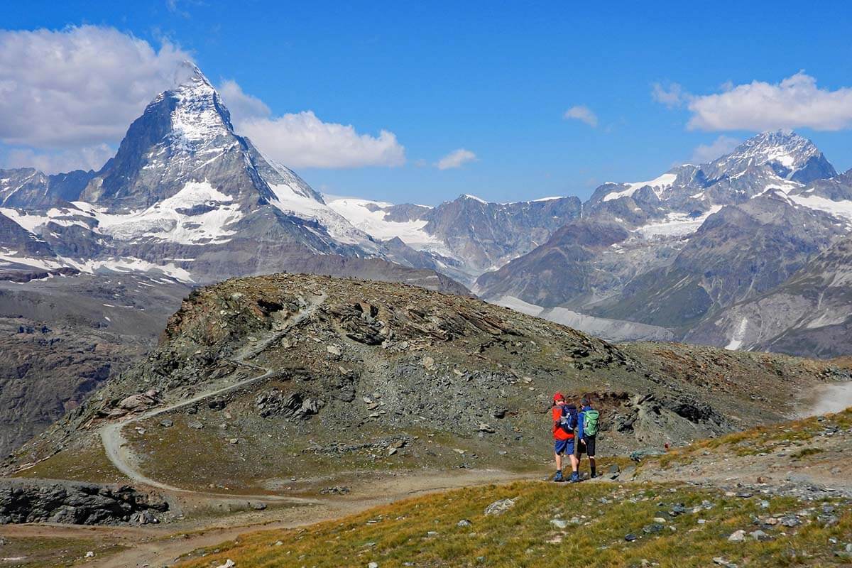 Kids hiking from Gornergrat to Riffelsee with view of the Matterhorn in Zermatt