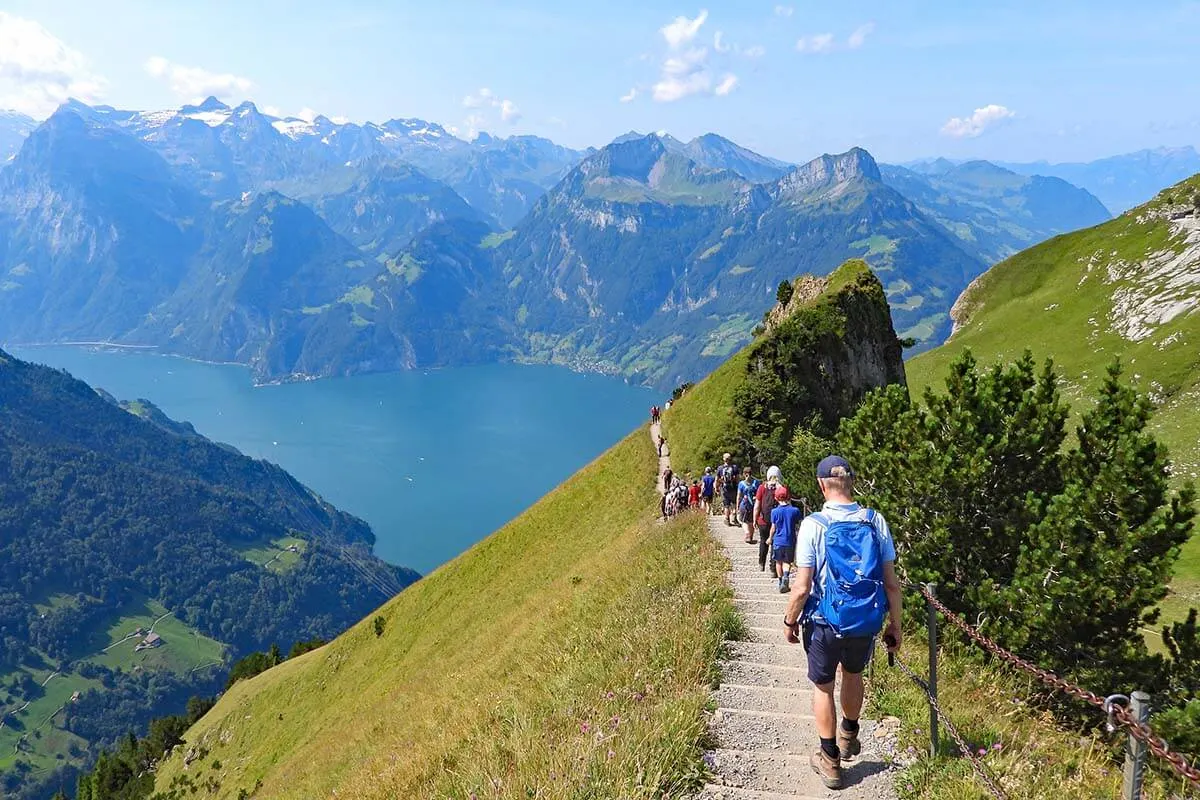 Crowds hiking on the Stoos ridge trail on a busy summer day in August