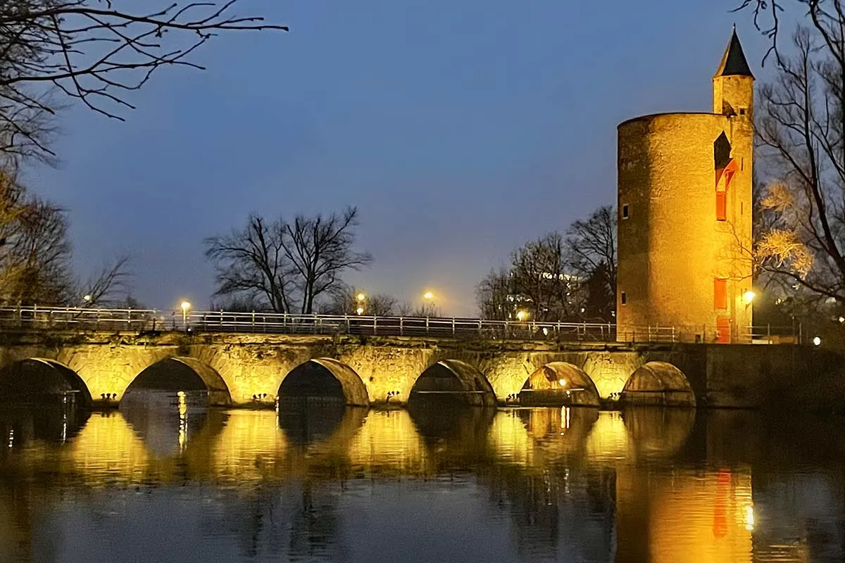 Powder Tower at Minnewater park in Bruges during winter holiday season