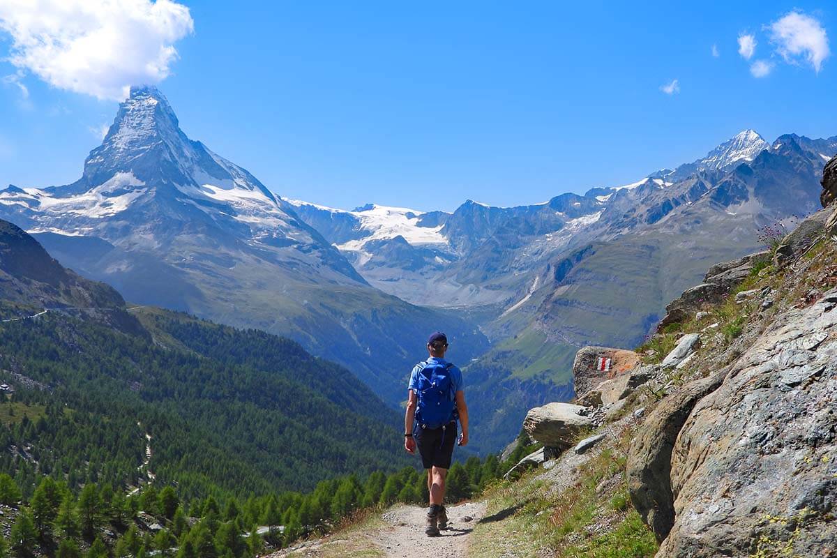 Hiker walking on the 5 Lakes Hike in Zermatt Switzerland