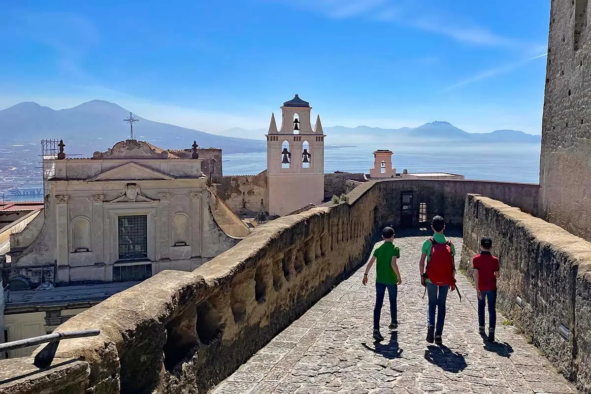 Kids walking at St Elmo Castle in Naples