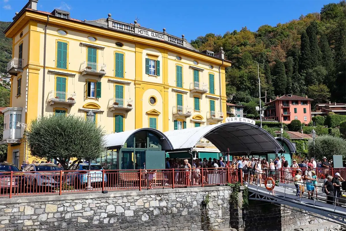 Busy ferry harbor in Varenna town on Lake Como, Italy