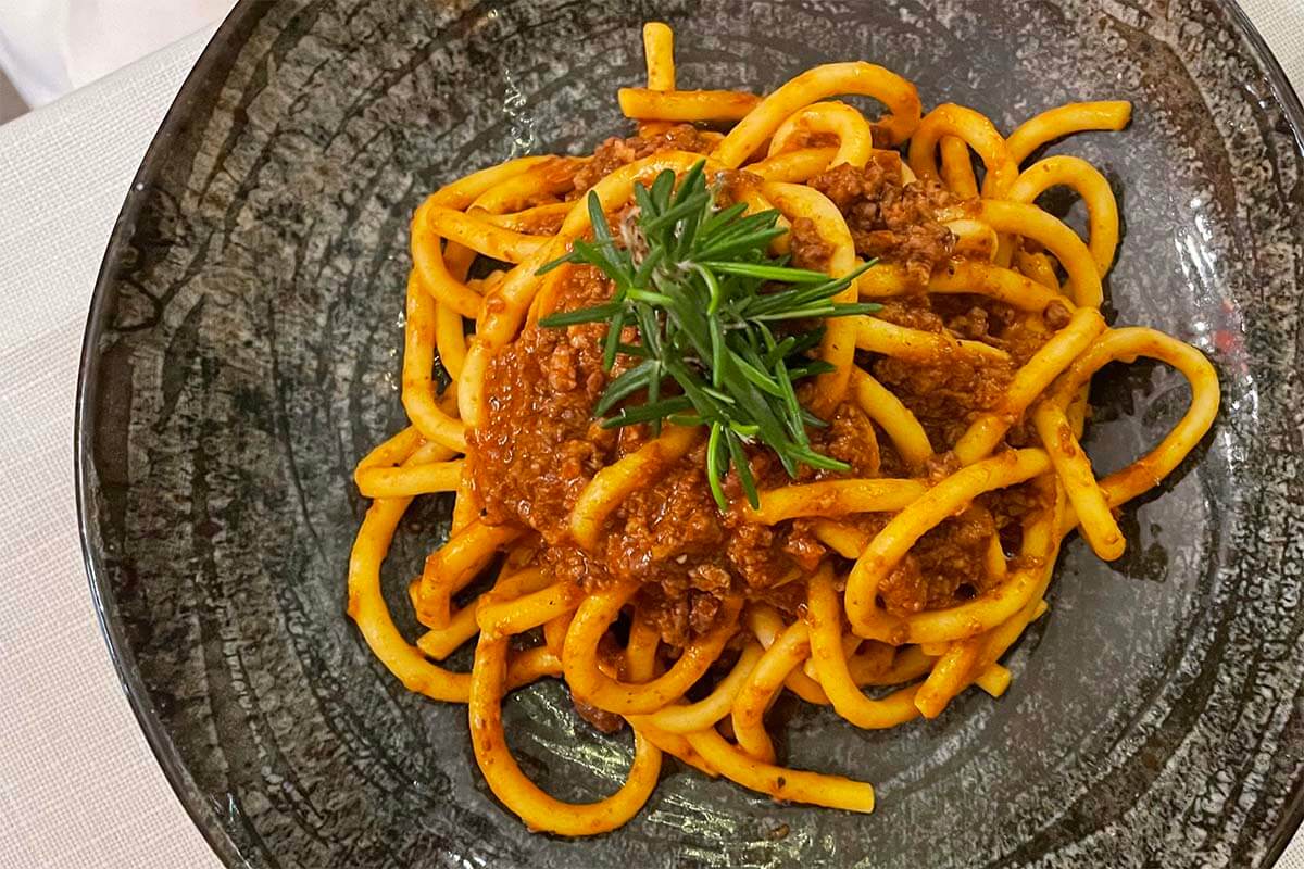 Italian pasta al ragu in a restaurant in Venice