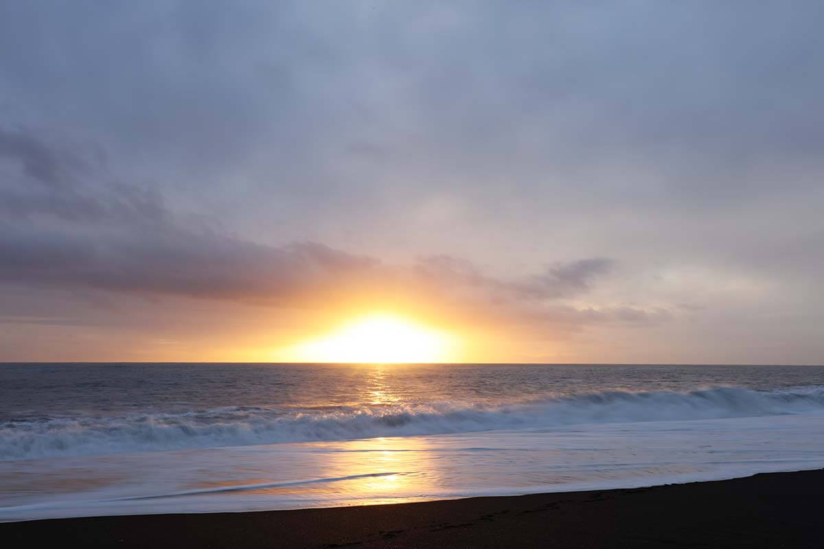 Sunset on Reynisfjara beach in Iceland in winter