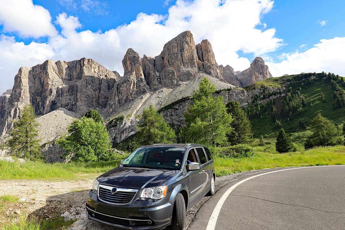 Car on the road at Gardena Pass in the Dolomites, Italy