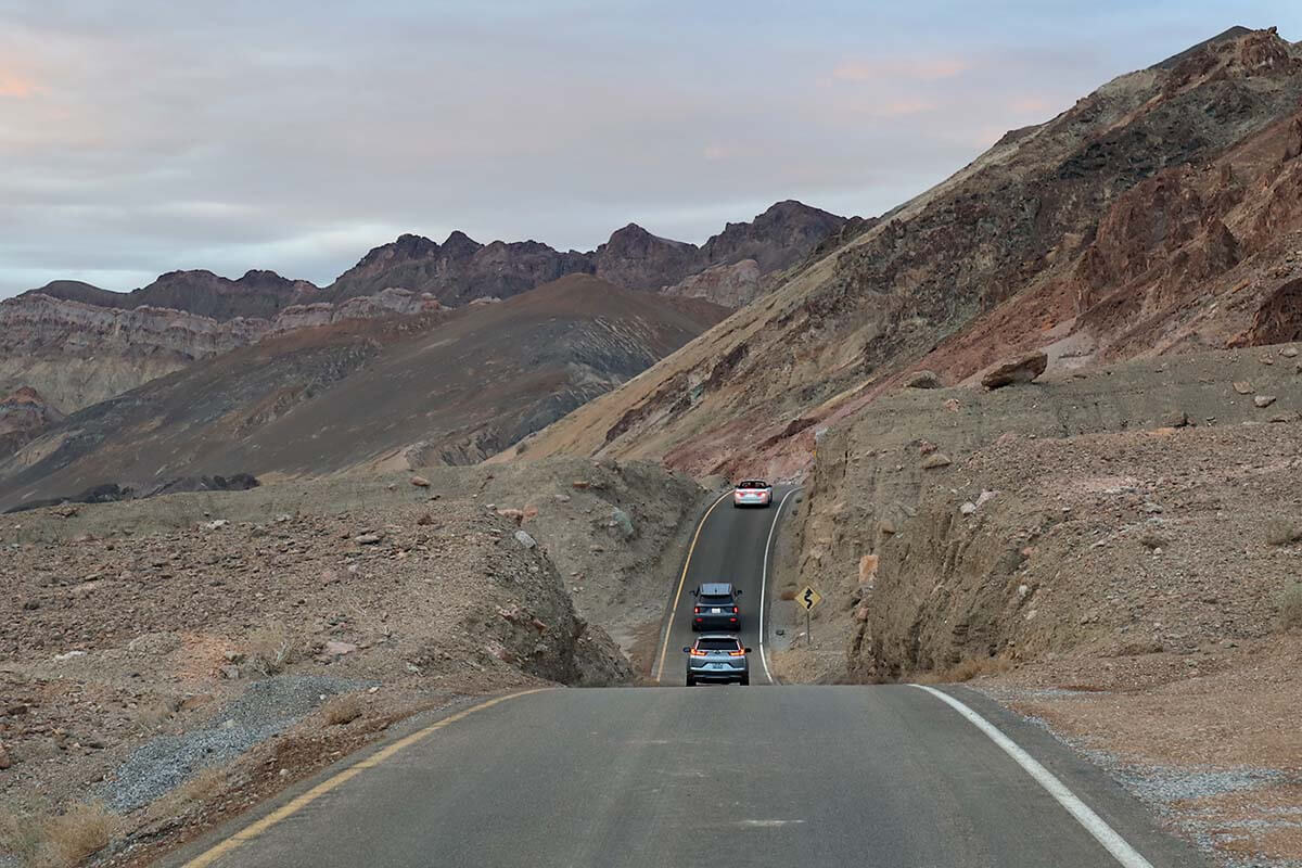 Cars driving scenic Artists Drive in Death Valley National Park