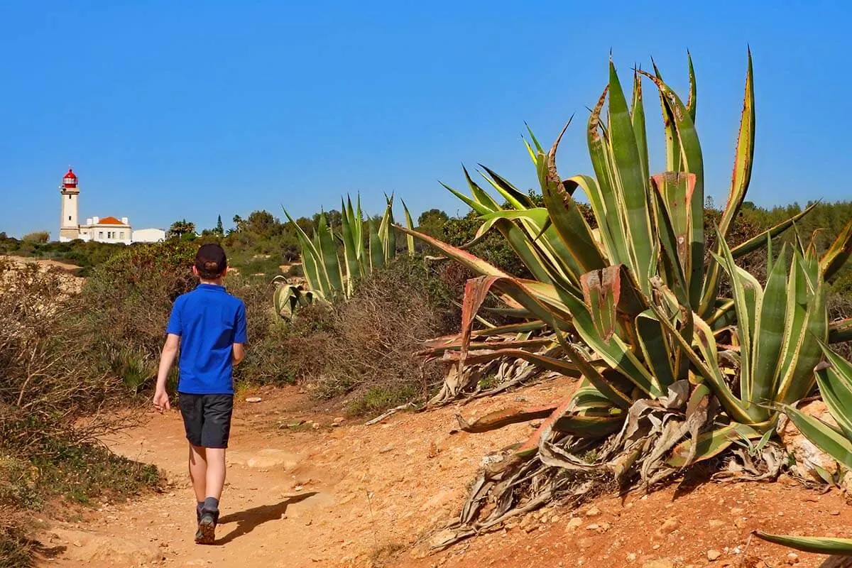 Child hiking on the Seven Hanging Valleys trail at Alfanzina Lighthouse