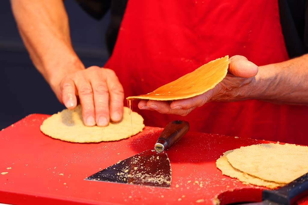 Fresh Dutch syrup waffles (stroopwafels) baked at Albert Cuyp market in Amsterdam