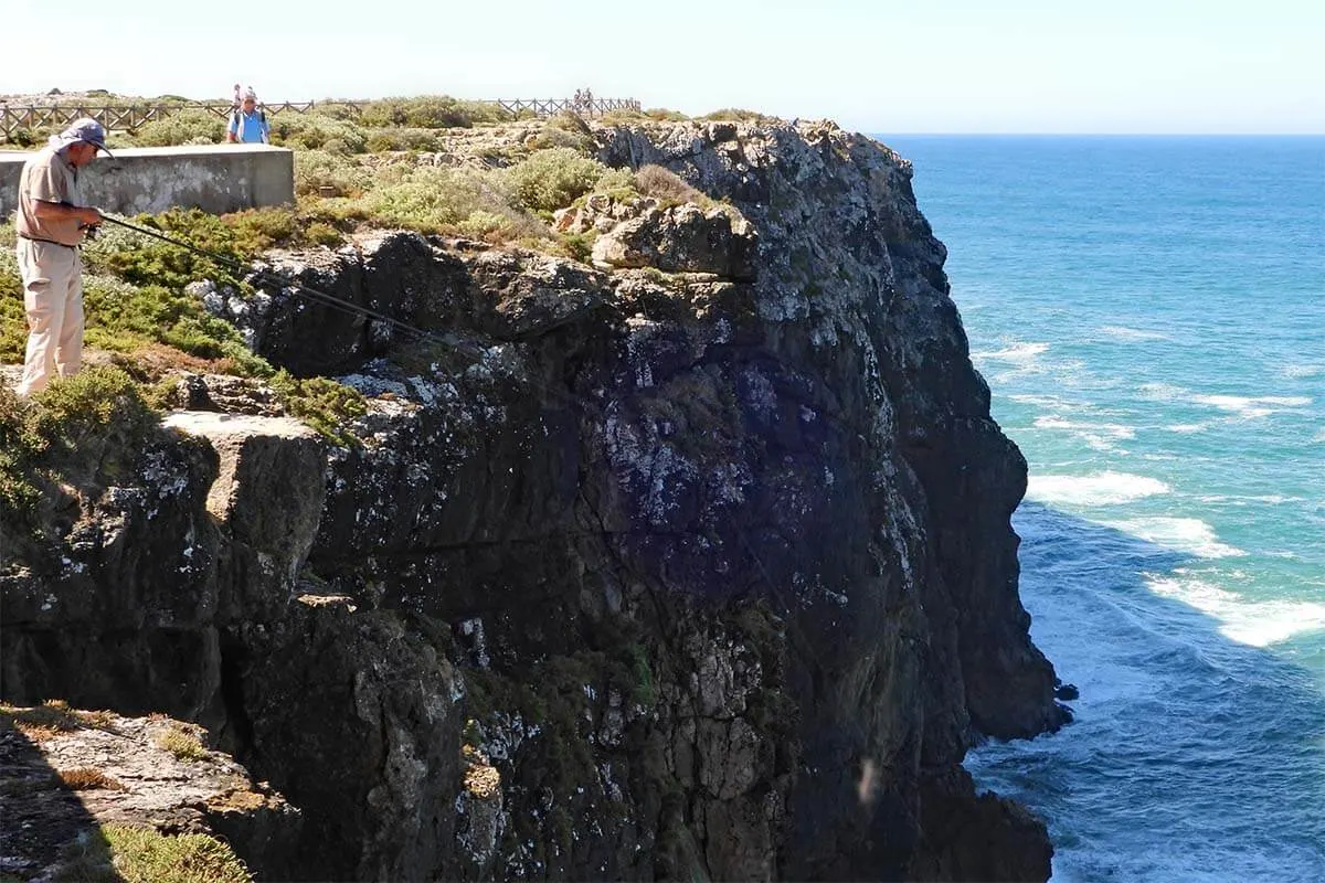 Fisherman fishing on the cliffs of Sagres headland at Sagres Fortress