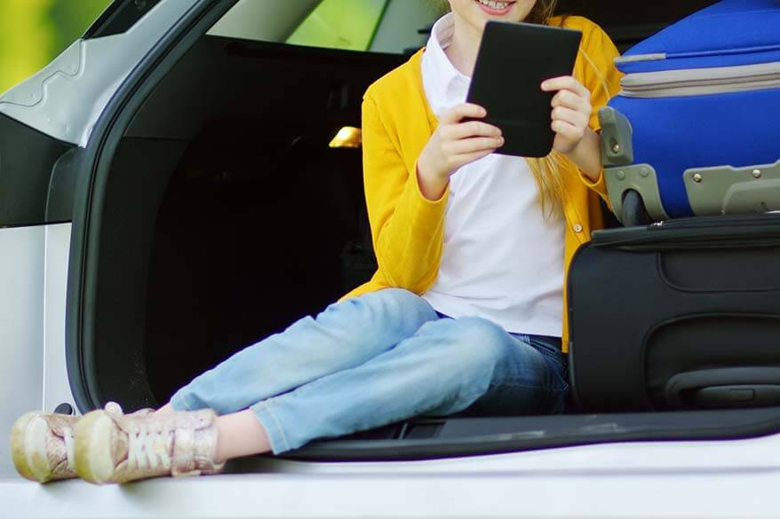 Girl reading ebook in the car