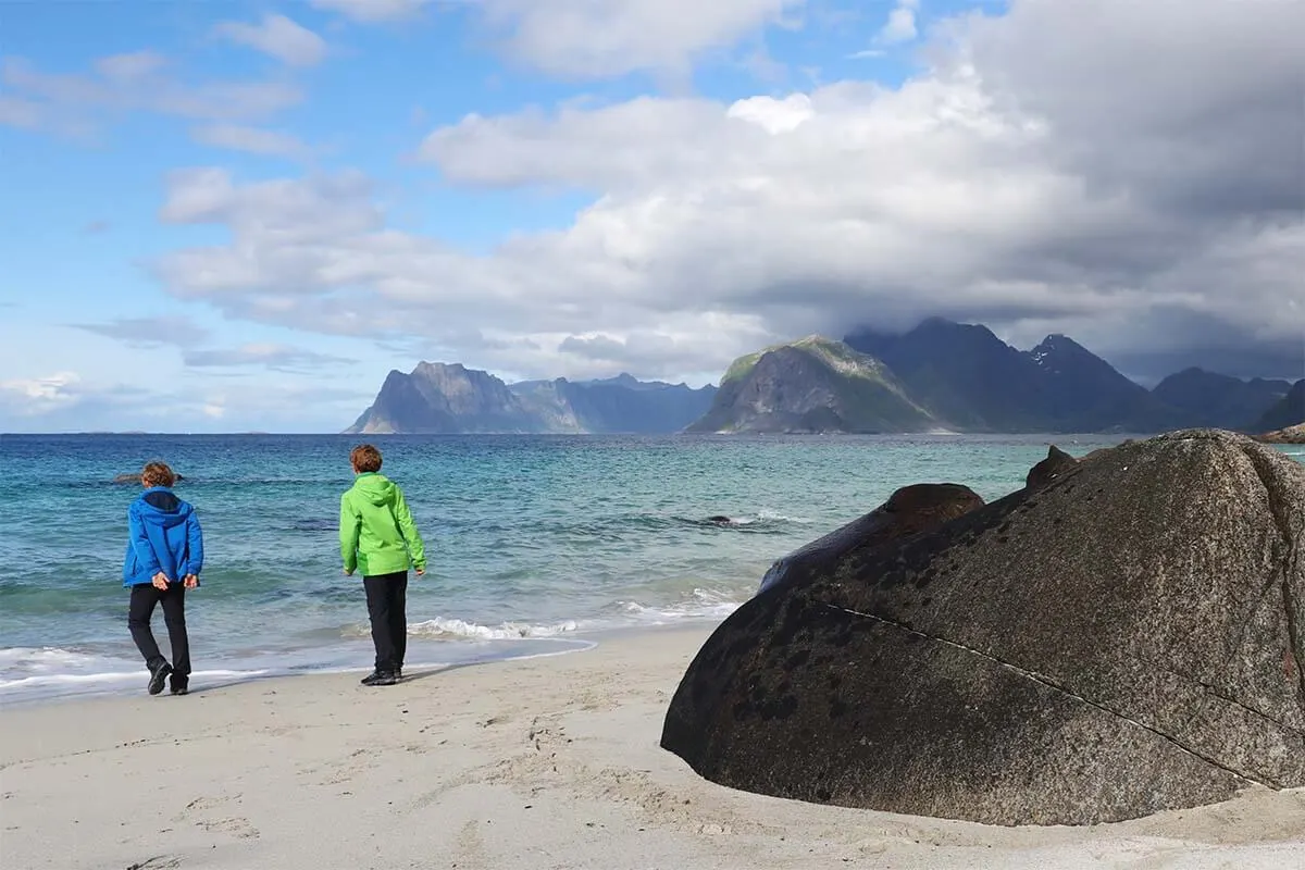 Kids on Myrland Beach on Lofoten Islands in summer