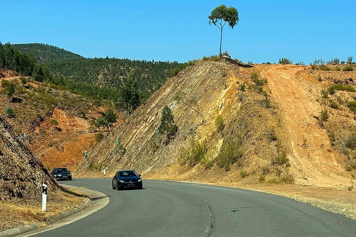 Cars driving on a road in Serra de Monchique hills in Algarve Portugal